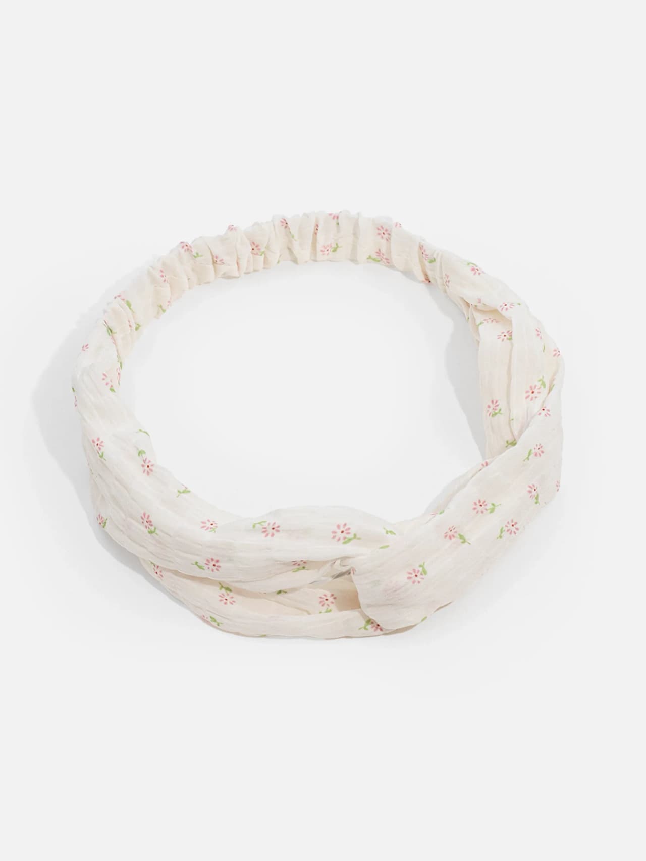 Knutat hårband i crèmevit crinkletyg med små rosa blommor