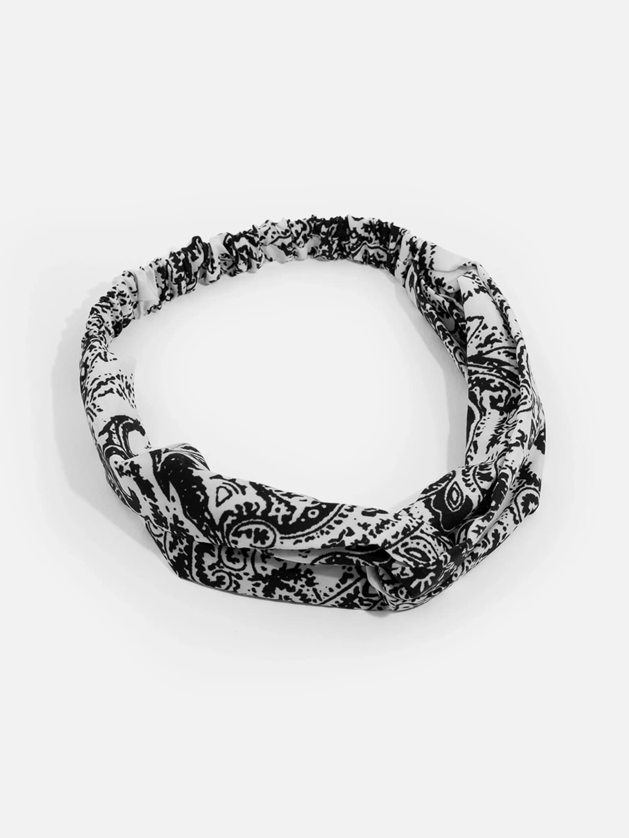 Knutat hårband i svartvitt paisley/barockornamentsmönster för dam