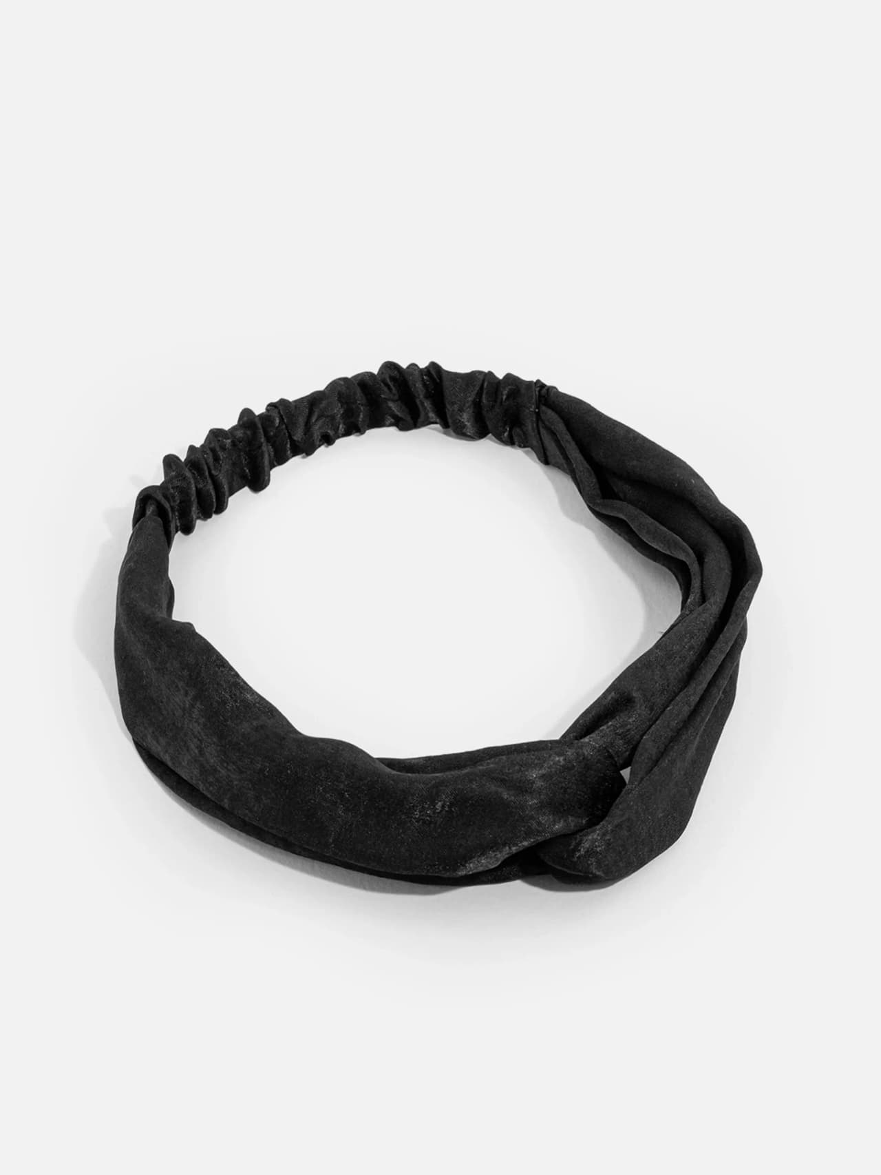 Knutat hårband i matt svart polyester med sammetsliknande yta