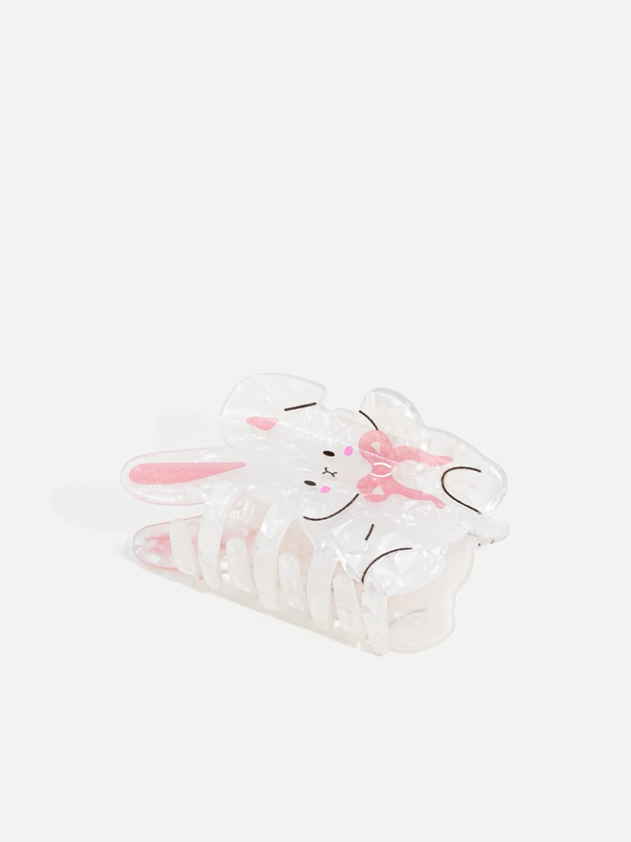 Kaninformad hårklämma i transparent ton med rosa detaljer och metallfjäder