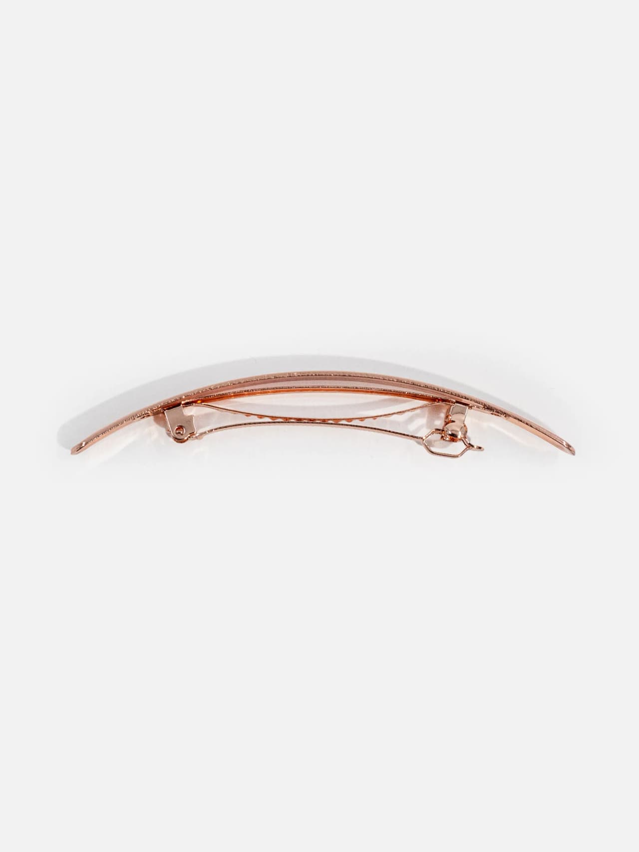Roséguldfärgat hårspänne i metall sett från sidan, 10 cm.