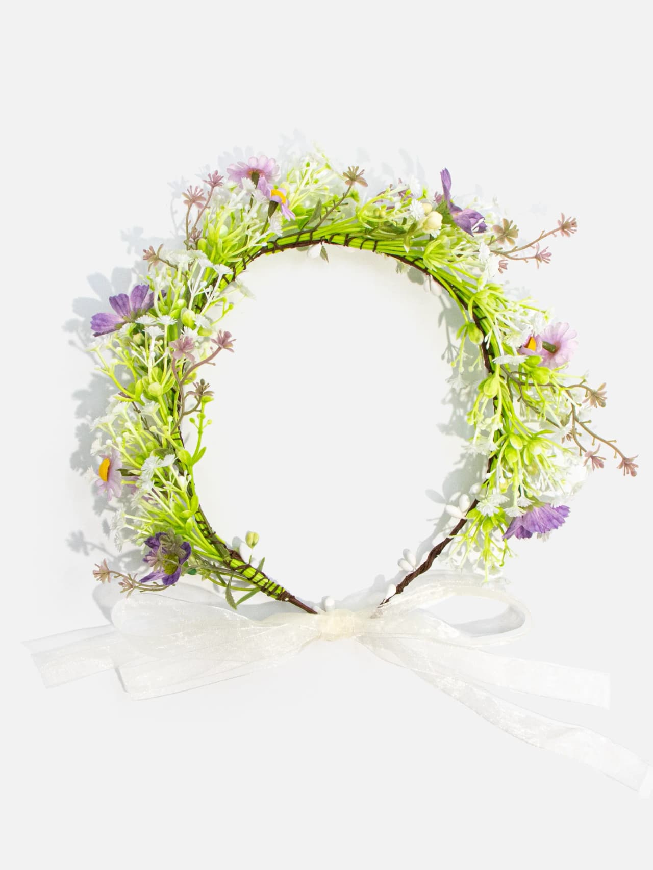 Ljus blomkrans i grönt och lila med justerbart band
