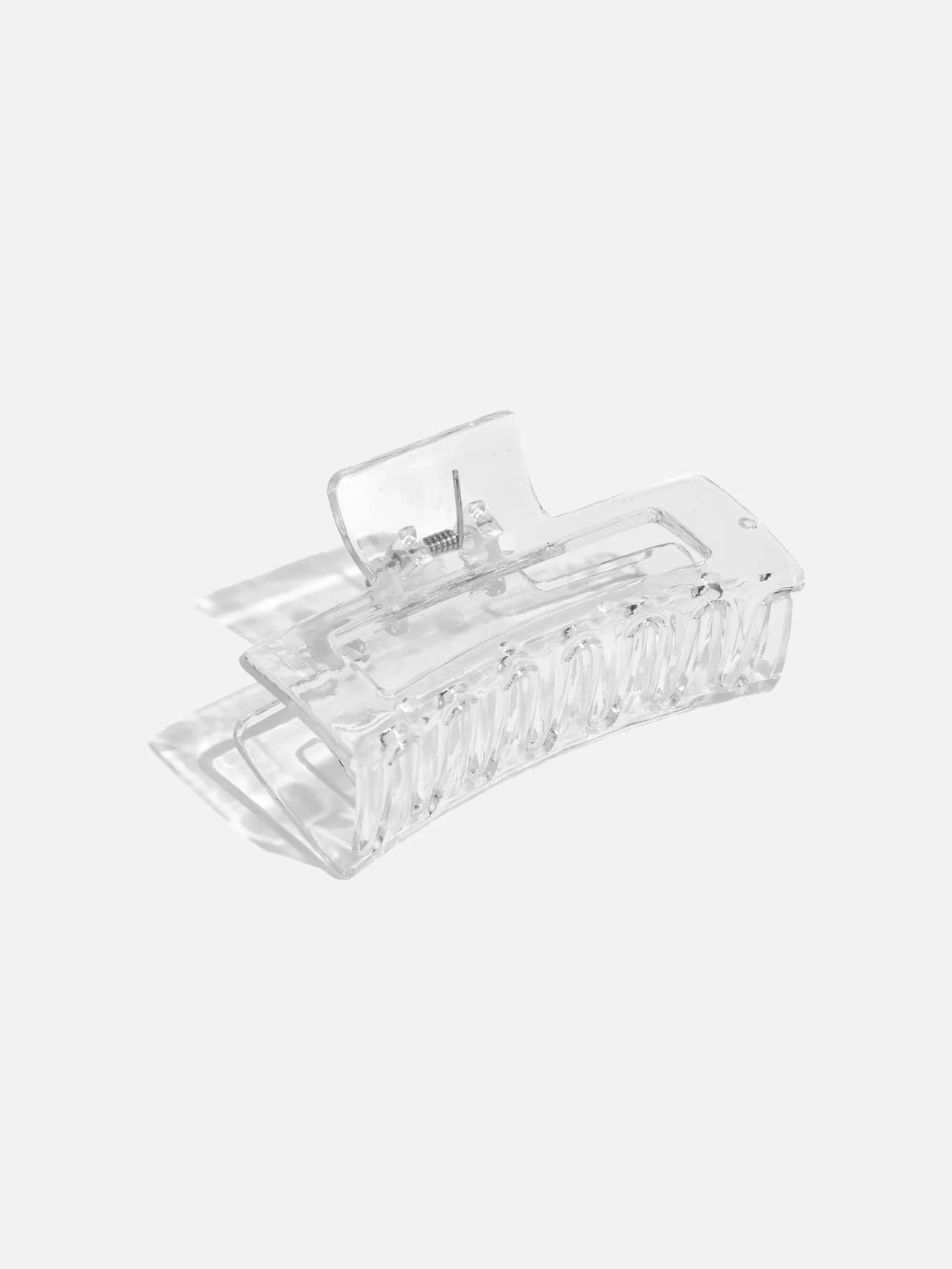Transparent hårklo i klar plast med rektangulär form, 8,5 cm bred