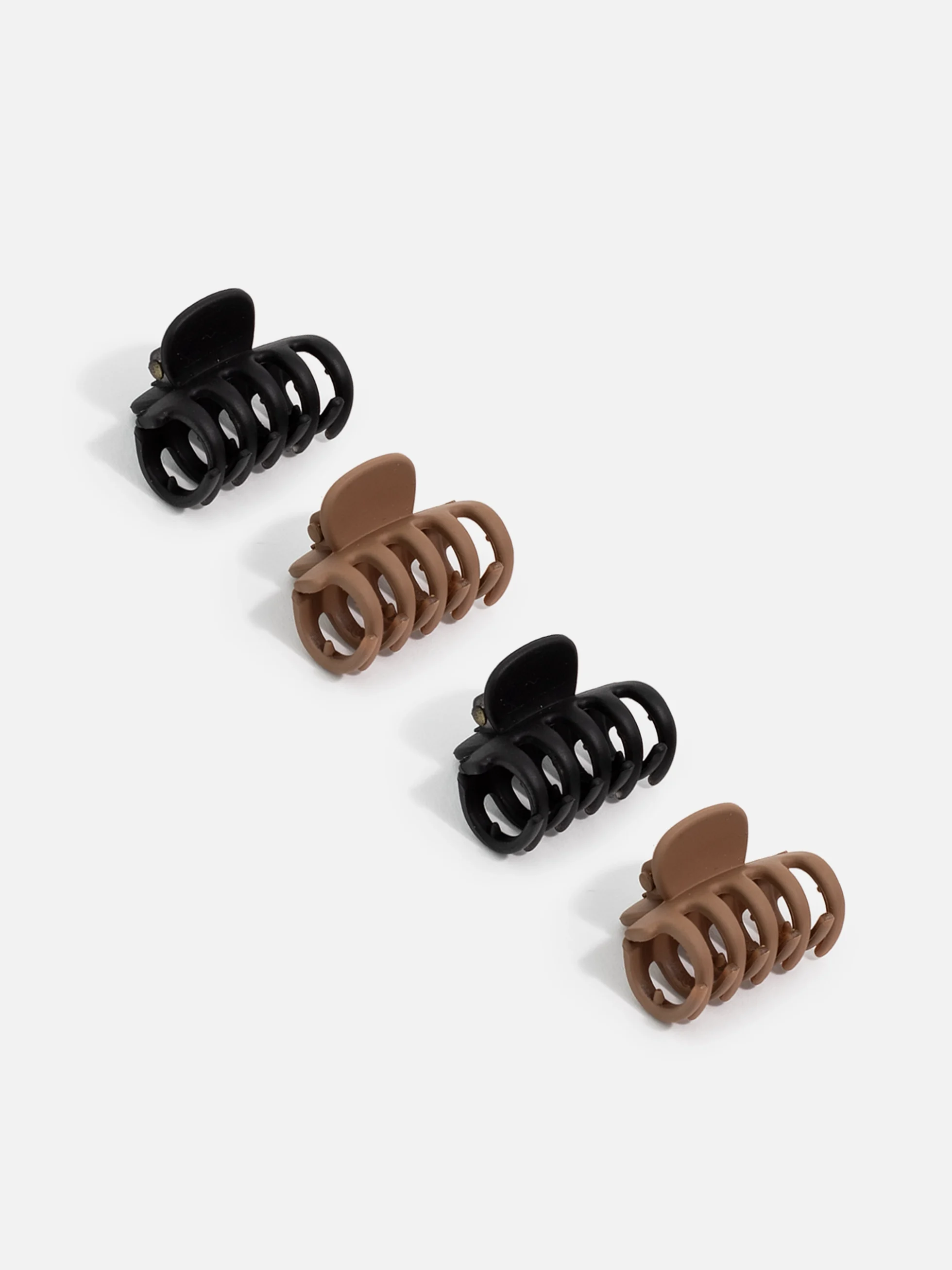 Set med små svarta och bruna hårklämmor i 4-pack