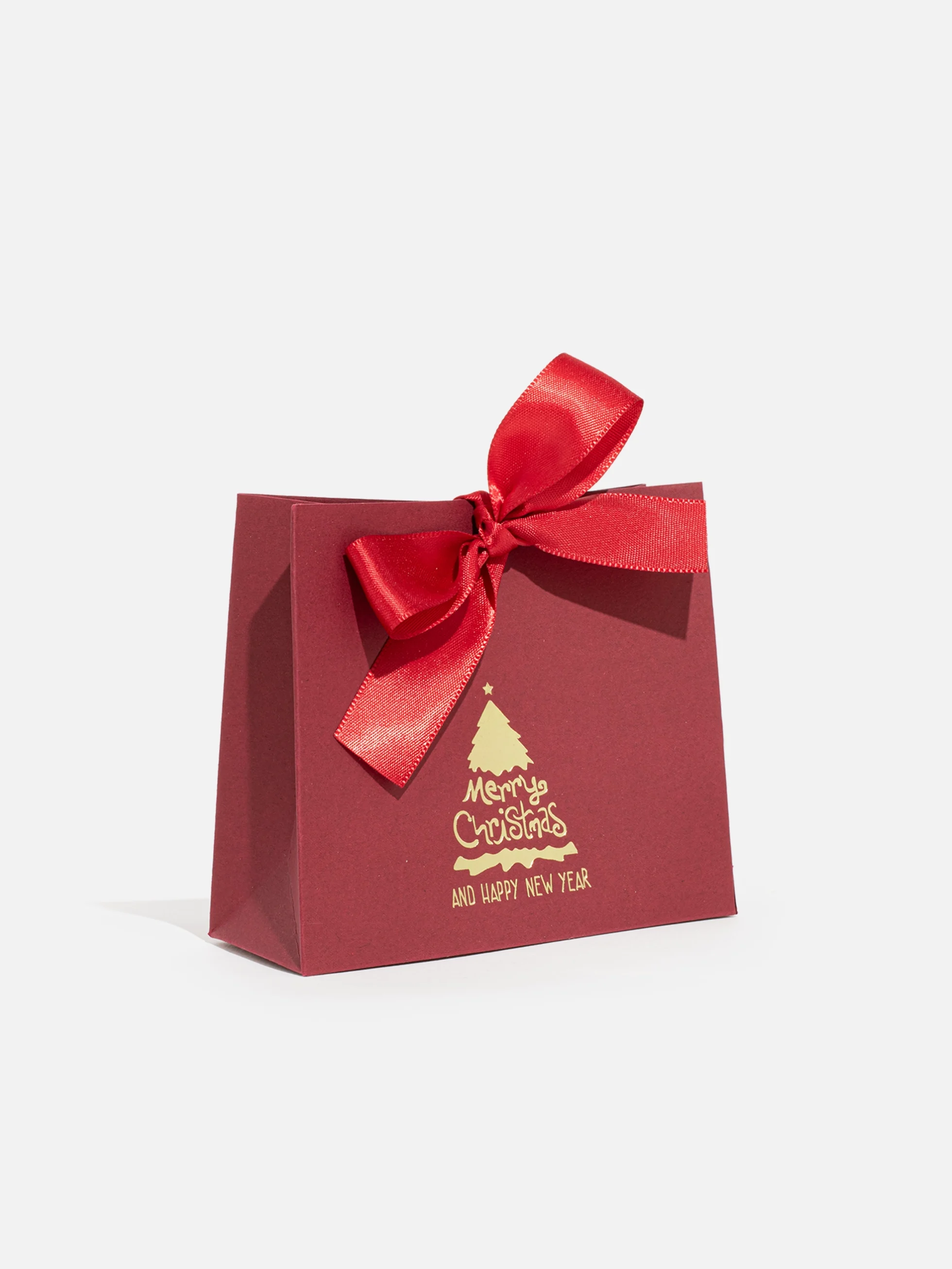Små röd jul Presentask med röd rosett, perfekt för smycken.