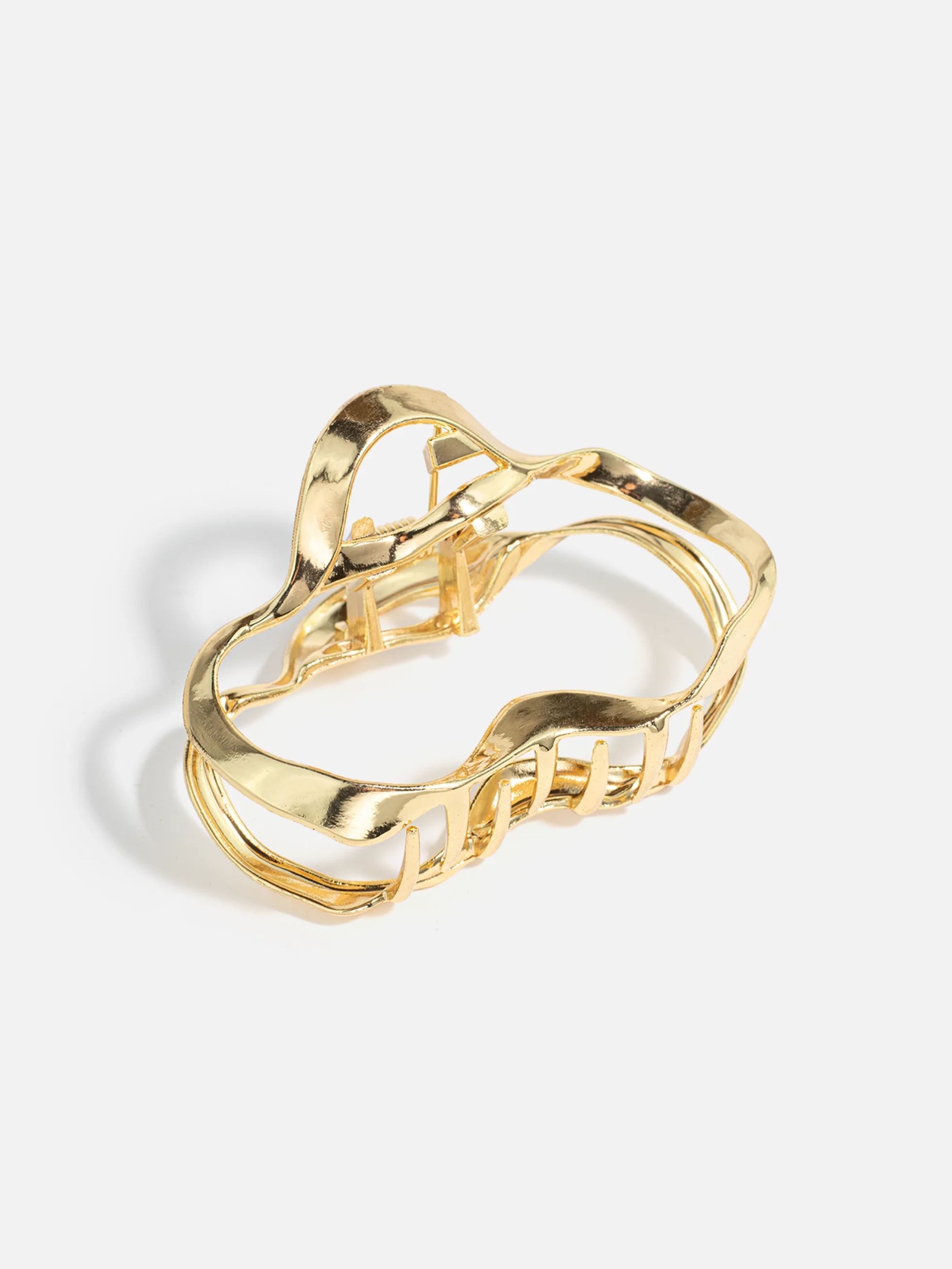 Elegant guldfärgad metall hårklämma för damer, perfekt för både vardagsbruk och festliga tillfällen.