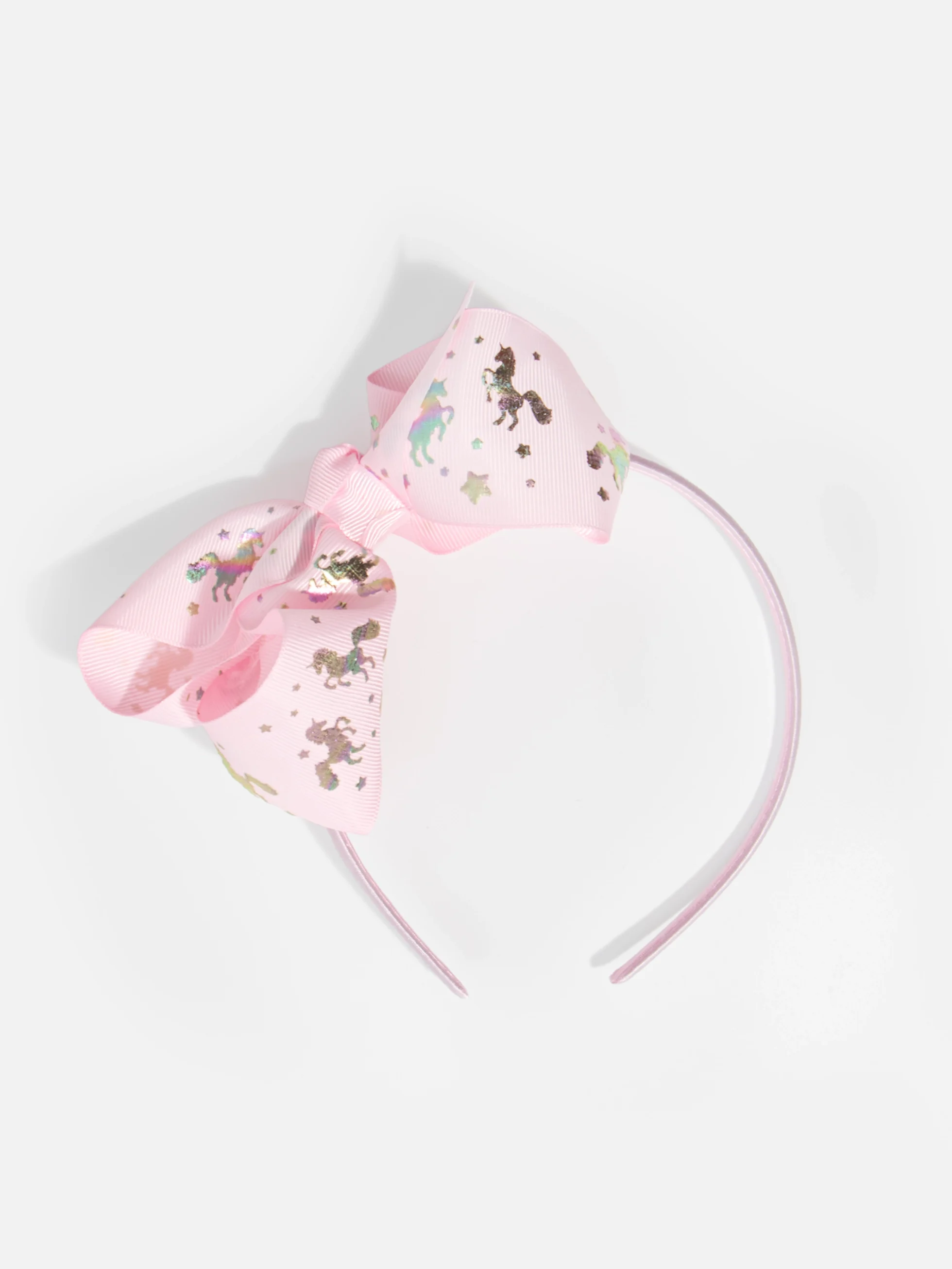 Diadem med rosa enhörningsrosett för barn, söt accessoar med enhörningsmotiv.